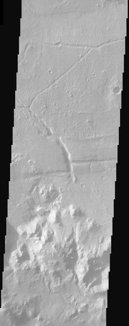 Ripple bedforms fill large fractures near the southern rim of Holden Crater in this image from NASA Mars Odyssey spacecraft.