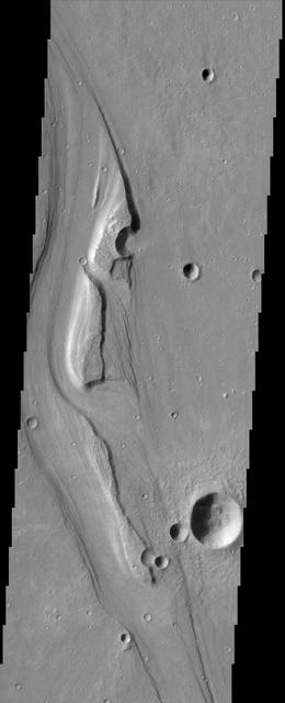 The sinuous channels and streamlined islands at the junction of Shalbatana and Simud Vallis, seen in this NASA Mars Odyssey image, present an erosional history of the catastrophic floods that scoured the Martian surface hundreds of millions of years ago.