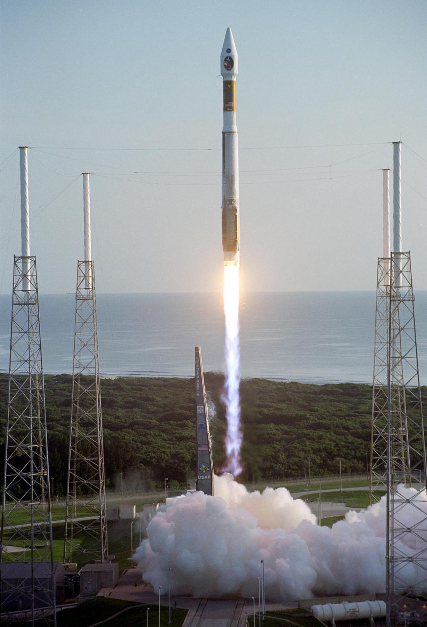 With the Atlantic Ocean as a backdrop, an Atlas V launch vehicle, 19 stories tall, with a two-ton NASA Mars Reconnaissance Orbiter MRO on top, roars away from Launch Complex 41 at Cape Canaveral Air Force Station.