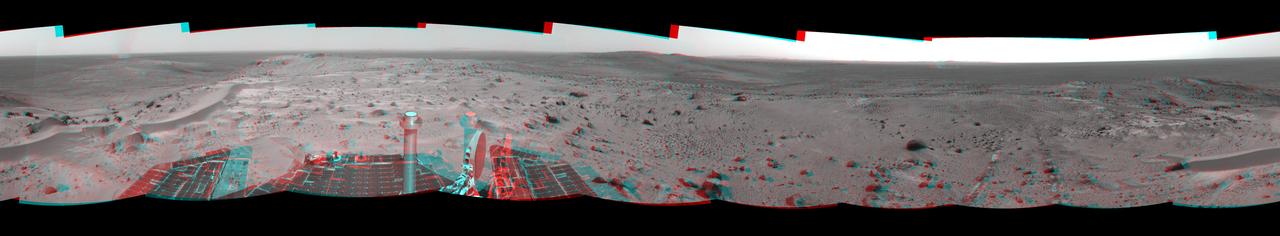 This anaglyph from NASA Mars Exploration Rover, Spiriti, was taken from the summit of Husband Hill, three dust devils are clearly visible in the plains of Gusev Crater. 3D glasses are necessary to view this image.