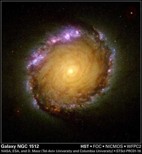 A rainbow of colors is captured in the center of a magnificent barred spiral galaxy, as witnessed by the three cameras of NASA Hubble Space Telescope.
