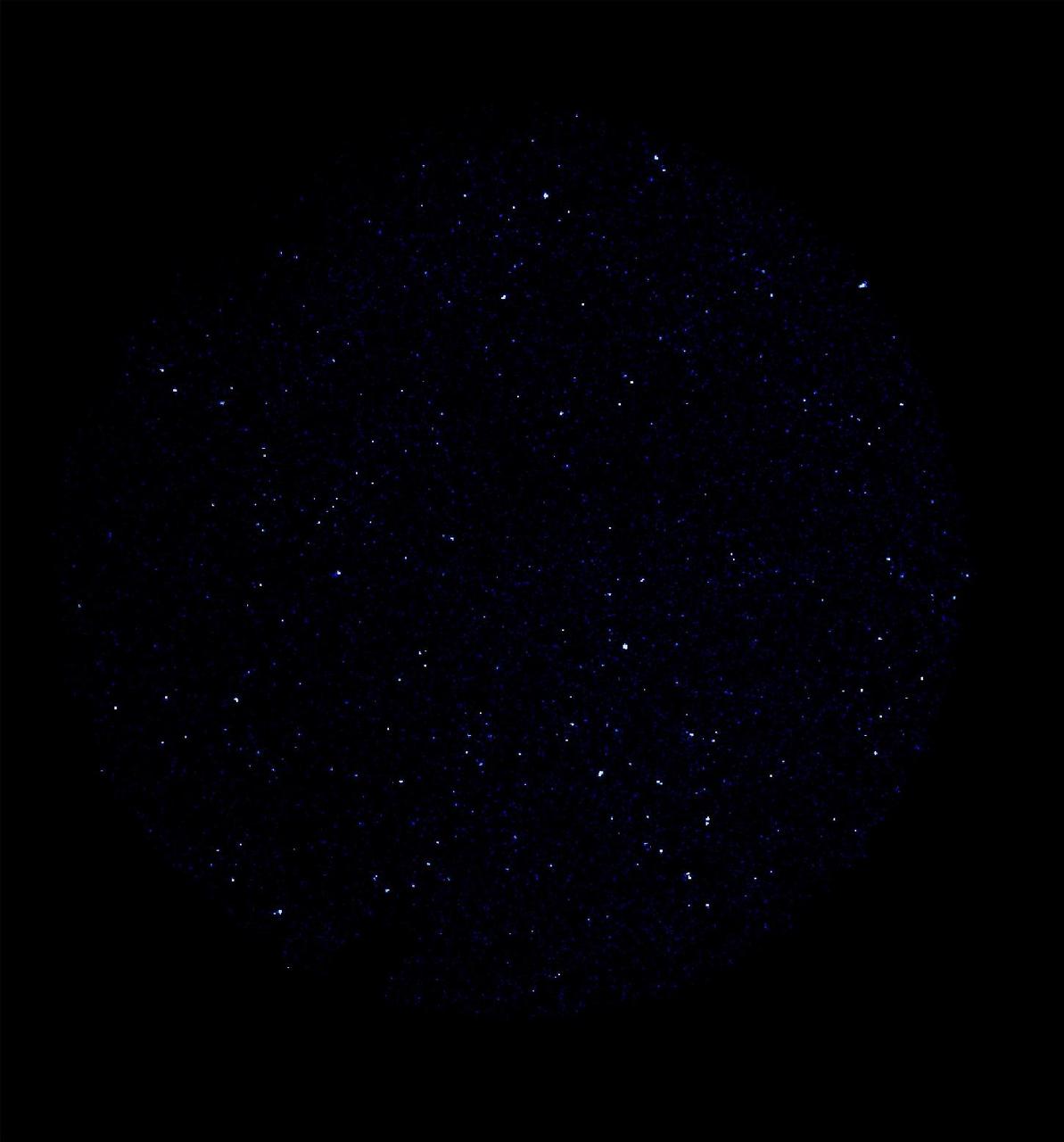 This image was taken May 21 and 22, 2003 by NASA Galaxy Evolution Explorer. The image was made from data gathered by the far ultraviolet channel of the spacecraft camera during the mission first light milestone. It shows about 400 celestial objects