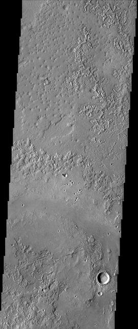 This image from NASA Mars Odyssey spacecraft shows Granicus Vallis, which is located northwest of the Elysium volcanic complex and may owe its origin to the interaction of volcanic heating and subsurface ground ice.