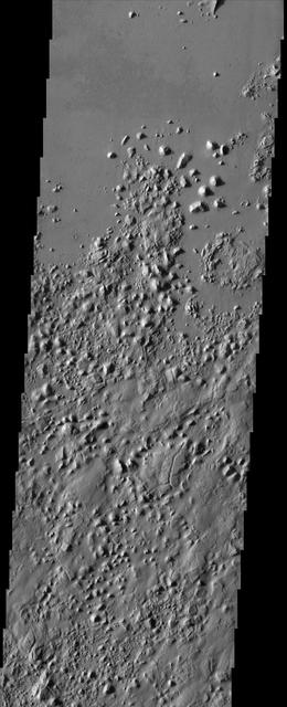 The smooth plains of Elysium embay the blocky broken up highlands of Aeolis in this image from NASA Mars Odyssey spacecraft. The plains have been interpreted by researchers to be possibly mudflows or lava flows.