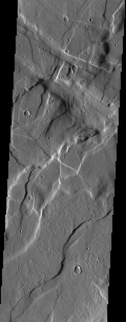 The crosscutting relationships observed in this image from NASA Mars Odyssey spacecraft can be used to determine the relative timing of graben and channel formations.
