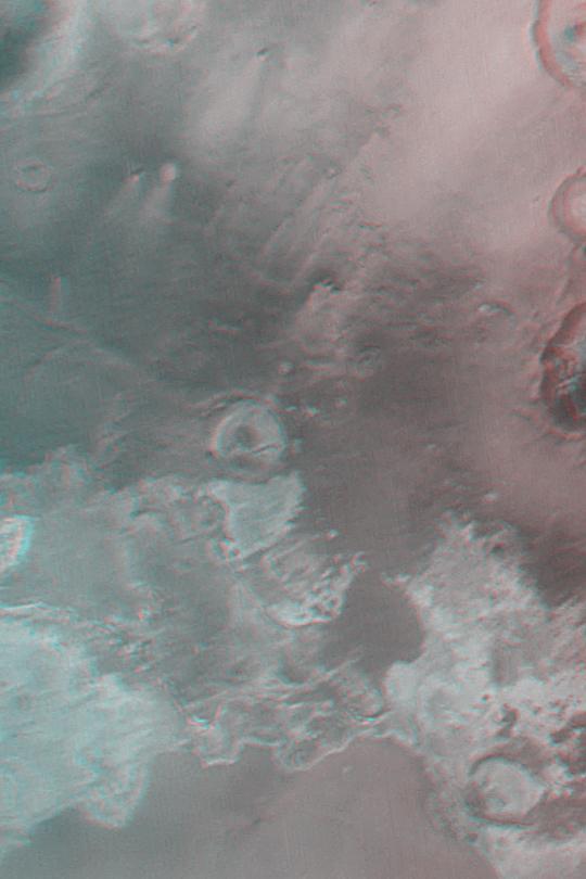 The light-toned materials at the bottom end of this anaglyph fomr NASA Mars Global Surveyor are considered to be thick exposures of sedimentary rock. 3D glasses are necessary to view this image.