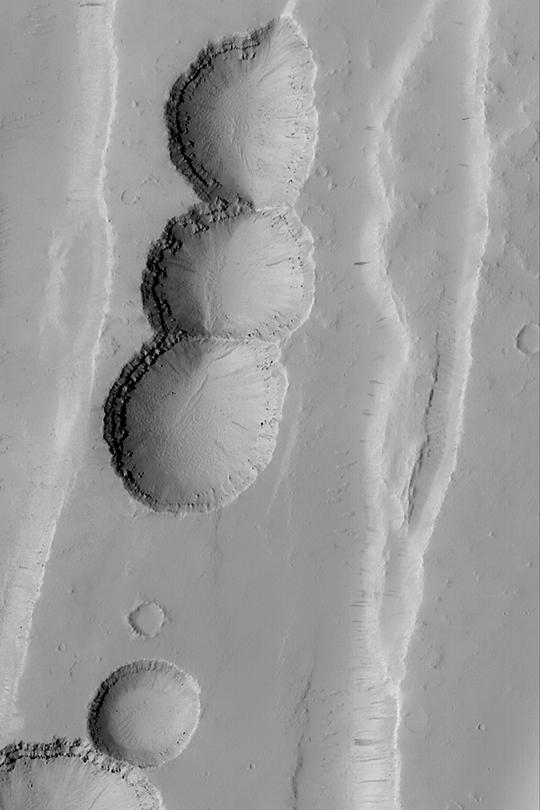 Tractus Catena Collapse Pits