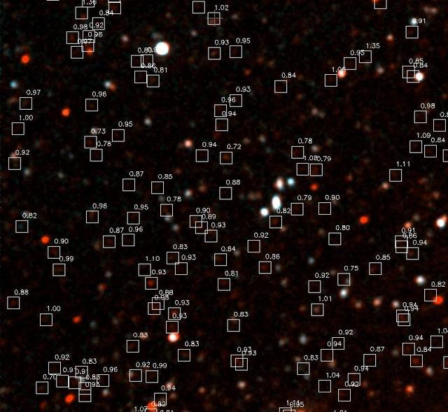 NASA's Galaxy Evolution Explorer photographed this ultraviolet color blowup of the Groth Deep Image on June 22 and June 23, 2003. Hundreds of galaxies are detected in this portion of the image, and the faint red galaxies are believed to be 6 billion light years away. The white boxes show the location of these distant galaxies, of which more than a 100 can be detected in this image. NASA astronomers expect to detect 10,000 such galaxies after extrapolating to the full image at a deeper exposure level. http://photojournal.jpl.nasa.gov/catalog/PIA04626