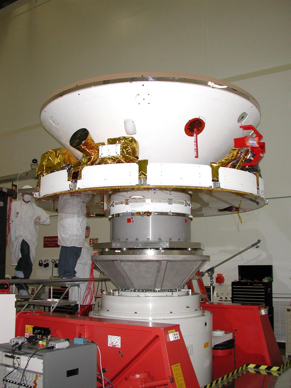 One of two Mars Exploration Rovers sits inside its cruise stage waiting to undergo environmental testing at NASA Jet Propulsion Laboratory.