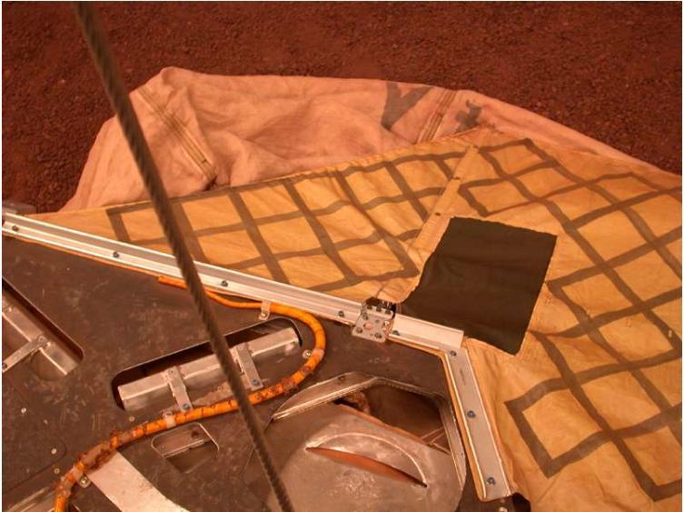 This image shows the airbags in deflated position at the JPL In-Situ Instrument Laboratory, where engineers tested the airbags to ensure a safe landing on Mars.