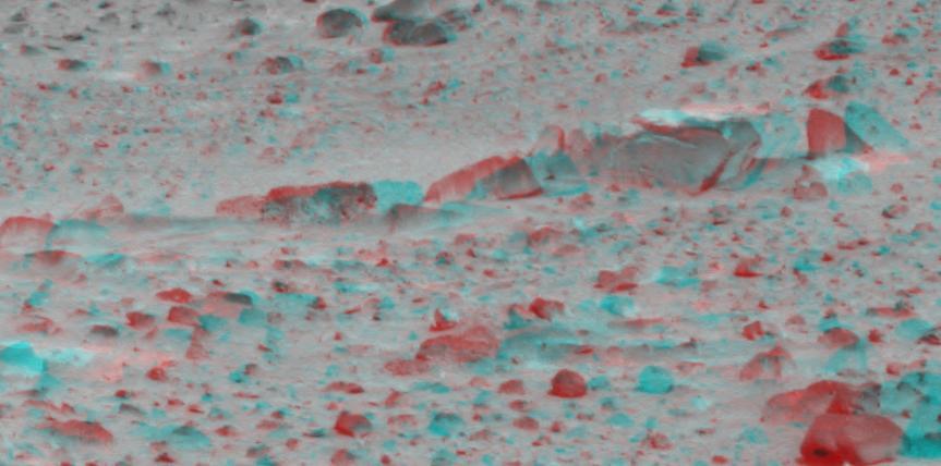 Dust-covered rocks can be seen in this portion of the 3D image taken by the panoramic camera on NASA Mars Exploration Rover Spirit. 3D glasses are necessary to view this image.