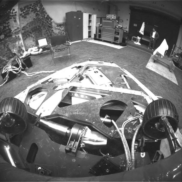 This image, taken in the JPL In-Situ Instruments Laboratory or Testbed, shows the view from the front hazard avoidance cameras on the Mars Exploration Rover Spirit after the rover has backed up and turned 45 degrees counterclockwise.