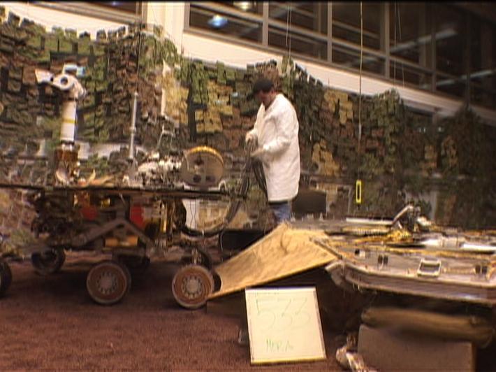 Footage from the JPL In-Situ Instruments Laboratory, or testbed, shows engineers rehearsing a crucial maneuver called egress in which NASA Mars Exploration Rover Spirit rolls off its lander platform and touches martian soil.