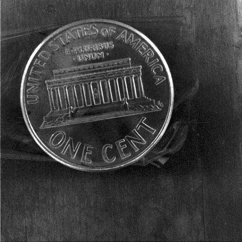 This close-up image of a penny shows the degree to which the microscopic imager on NASA Mars Exploration Rover Spirit can zoom in on a target.