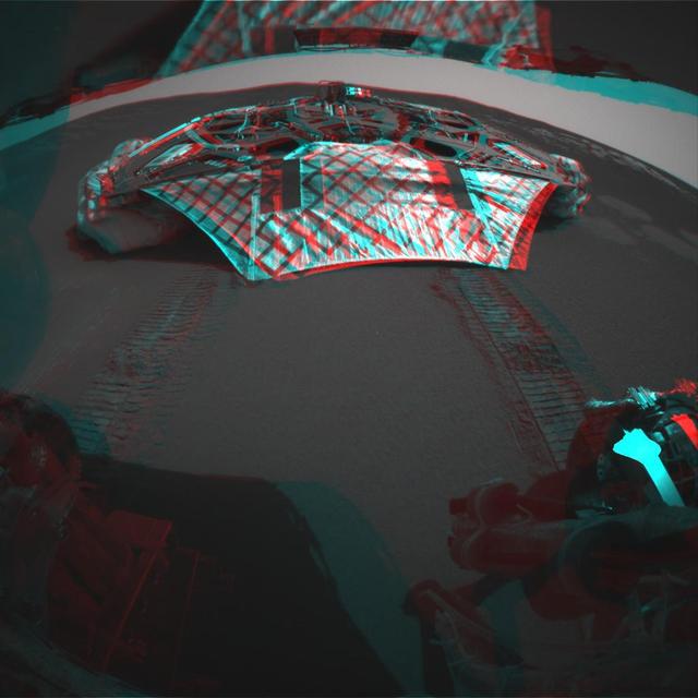 This 3-D image captured by NASA Mars Exploration Rover Opportunity rear hazard-identification camera shows the now-empty lander that carried the rover 283 million miles to Meridiani Planum, Mars. 3D glasses are necessary to view this image.