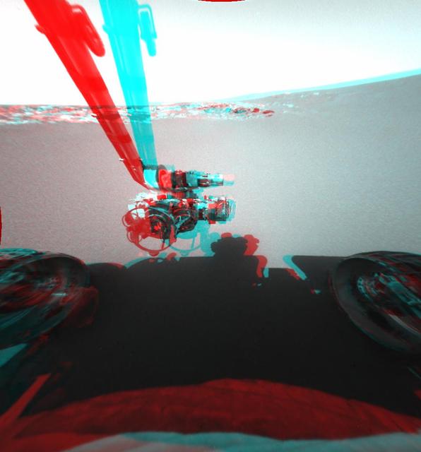 This is a three-dimensional stereo anaglyph of an image taken by the front hazard-identification camera onboard NASA Mars Exploration Rover Opportunity, showing the rover arm in its extended position. 3D glasses are necessary to view this image.