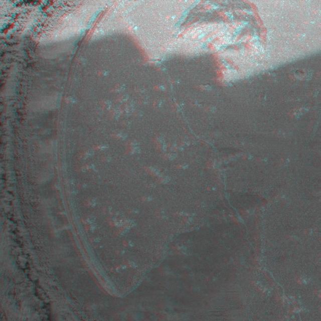 This 3D anaglyph, from NASA Mars Exploration Rover Spirit, shows a microscopic image taken of the rock called Adirondack. 3D glasses are necessary to view this image.