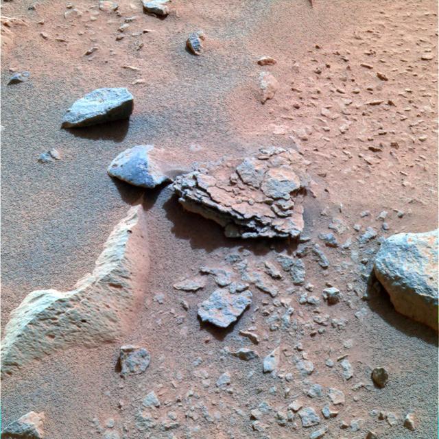 This color image taken by the Mars Exploration Rover Spirit's panoramic camera on Sol 40 is centered on an unusually flaky rock called Mimi. Mimi is only one of many features in the area known as "Stone Council," but looks very different from any rock that scientists have seen at the Gusev crater site so far. Mimi's flaky appearance leads scientists to a number of hypotheses. Mimi could have been subjected to pressure either through burial or impact, or may have once been a dune that was cemented into flaky layers, a process that sometimes involves the action of water. http://photojournal.jpl.nasa.gov/catalog/PIA05283