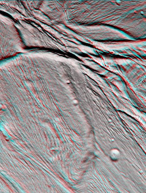 NASA Cassini spacecraft took images of the ropy, taffy-like topography of Saturn moon Enceladus from many different angles as the spacecraft flew by on Feb. 17, 2005. 3D glasses are necessary to view this image.