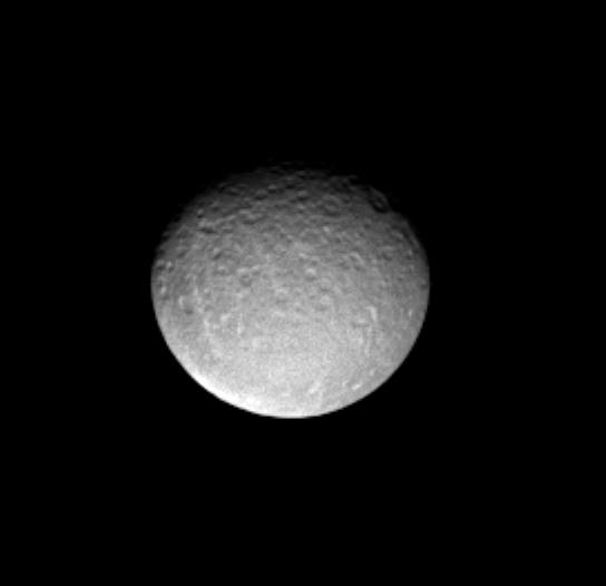 This Cassini image shows predominantly the impact-scarred leading hemisphere of Saturn's icy moon Rhea (1,528 kilometers, or 949 miles across).  The image was taken in visible light with the Cassini spacecraft narrow angle camera on Dec. 12, 2004, at a distance of 2 million kilometers (1.2 million miles) from Rhea and at a Sun-Rhea-spacecraft, or phase, angle of 30 degrees. The image scale is about 12 kilometers (7.5 miles) per pixel. The image has been magnified by a factor of two and contrast enhanced to aid visibility.   http://photojournal.jpl.nasa.gov/catalog/PIA06564