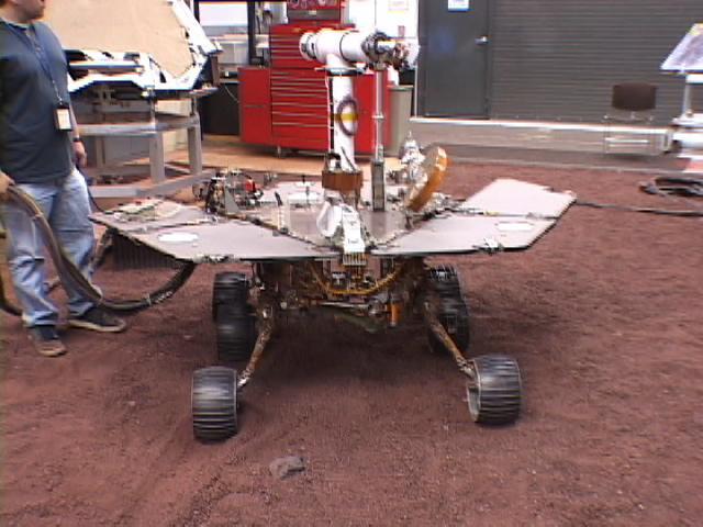 This picture shows a model of NASA Mars Exploration Rover Spirit being tested for performance on five wheels at NASA Jet Propulsion Laboratory.