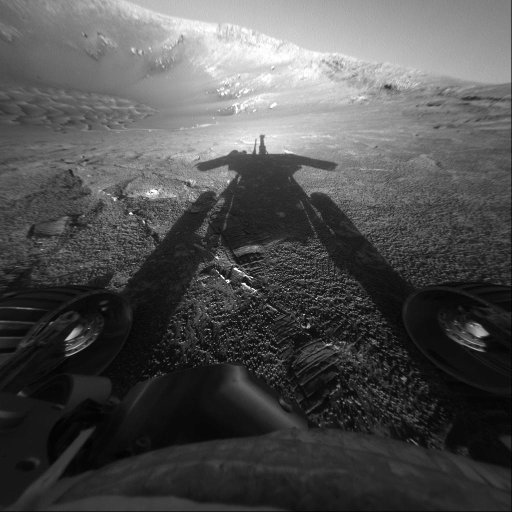 This self-portrait of NASA Mars Exploration Rover Opportunity comes courtesy of the Sun and the rover front hazard-avoidance camera. The dramatic snapshot of Opportunity shadow was taken as the rover continues to move farther into Endurance Crater