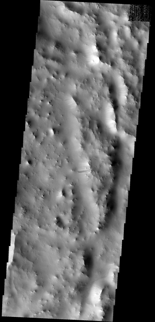 This dust avalanche is located on the rim material of an unnamed crater to the east of Tikhonravov Crater