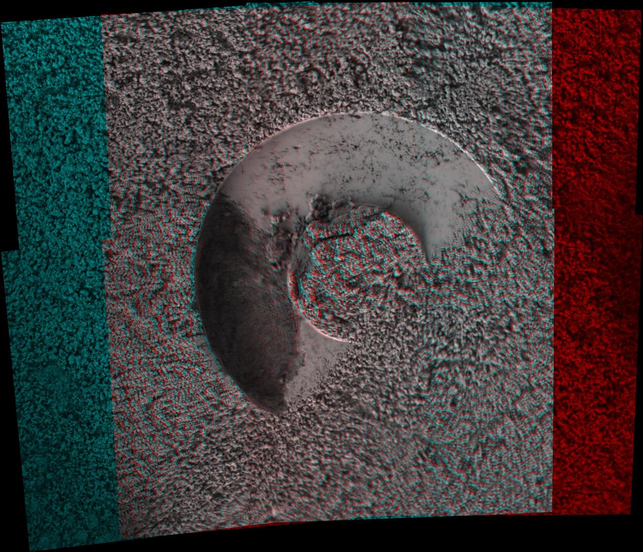 NASA Mars Exploration Rover microscopic imager onboard Spirit revealed a gap less than half an inch in the imprint left behind in the soil. 3D glasses are necessary to view this image.