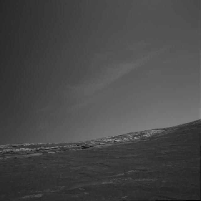 NASA image: Clouds Over Crater Rim