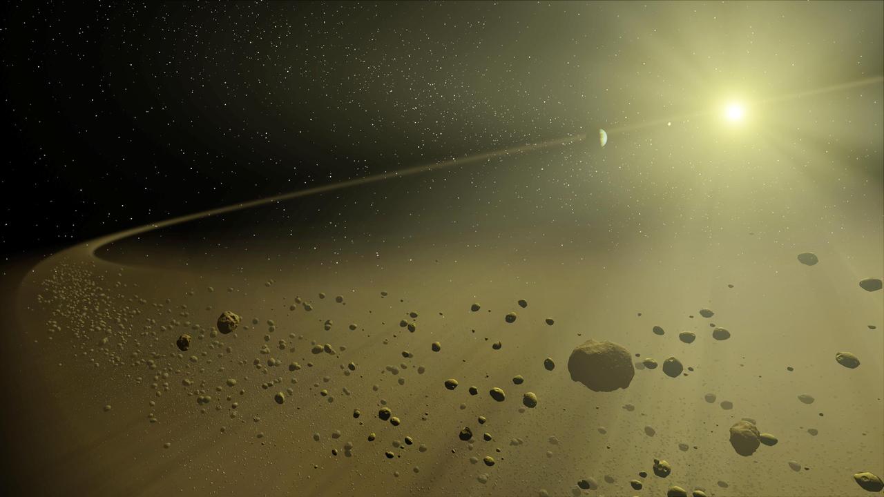 This artist concept depicts a distant hypothetical solar system, similar in age to our own. Looking inward from the system outer fringes, a ring of dusty debris can be seen, and within it, planets circling a star the size of our Sun.  This debris is all that remains of the planet-forming disk from which the planets evolved. Planets are formed when dusty material in a large disk surrounding a young star clumps together. Leftover material is eventually blown out by solar wind or pushed out by gravitational interactions with planets. Billions of years later, only an outer disk of debris remains.  These outer debris disks are too faint to be imaged by visible-light telescopes. They are washed out by the glare of the Sun. However, NASA's Spitzer Space Telescope can detect their heat, or excess thermal emission, in infrared light. This allows astronomers to study the aftermath of planet building in distant solar systems like our own.  http://photojournal.jpl.nasa.gov/catalog/PIA07096
