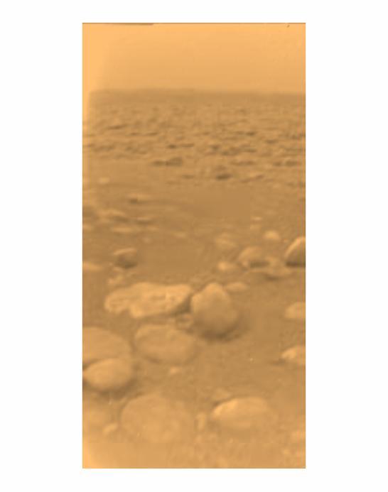 This image was returned on Jan 14, 2005, by the European Space Agency Huygens probe during its successful descent to land on Titan. This colored view, following processing to add reflection spectra data, gives a better indication of the actual color.