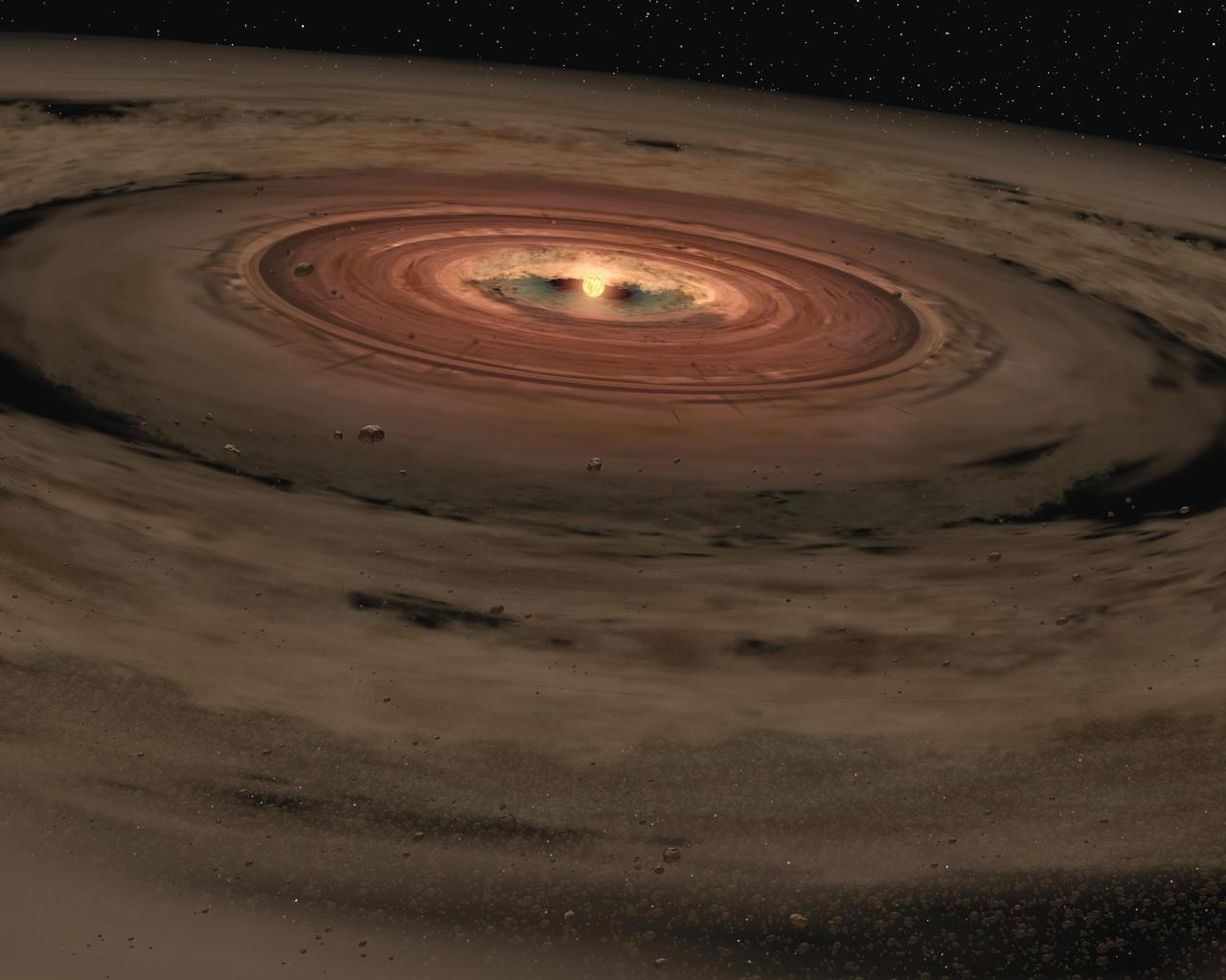 This artist animation shows a brown dwarf surrounded by a swirling disc of planet-building dust. NASA Spitzer Space Telescope spotted such a disc around a surprisingly low-mass brown dwarf, or failed star.