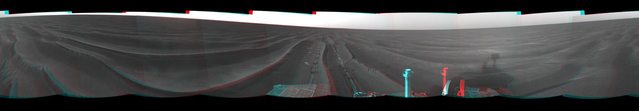 On Feb. 19, 2005, NASA Mars Exploration Rover Opportunity set a one-day distance record for martian driving; Opportunity rolled 177.5 meters 582 feet across the plain of Meridiani. 3D glasses are necessary to view this image.
