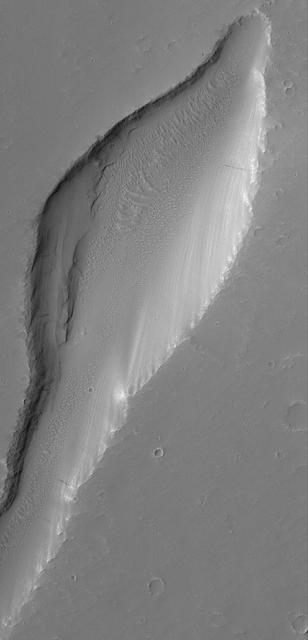 9 March 2005 This Mars Global Surveyor (MGS) Mars Orbiter Camera (MOC) image shows a trough in the Labyrinthus Noctis region. Location near: 1.5°S, 92.5°W Image width: ~3 km (~1.9 mi) Illumination from: upper left Season: Southern Winter http://photojournal.jpl.nasa.gov/catalog/PIA07449