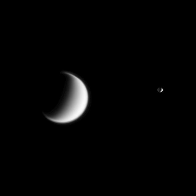 Titan, Saturn largest moon and Mimas in the foreground are seen together  in this view from Cassini. Titan gravity is weaker than Earth, so the  moon atmosphere is quite extended -- a quality hinted at in this view