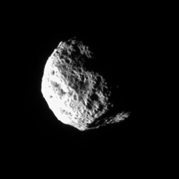 The tumbling and irregularly shaped moon Hyperion rotates away from the Cassini spacecraft in this movie taken during a distant encounter in Dec. 2005. A shadow closes over the large crater at bottom as the movie progresses.  Hyperion (280 kilometers, or 174 miles across) is covered with closely packed and deeply etched pits. The warming action of the Sun on water ice lying beneath a darkened layer of surface material apparently has deepened and exaggerated the depressions already created by impacts.  Cassini scientists now think that Hyperion’s unusual appearance can be attributed to the fact that it has an unusually low density for such a large object, giving it weak surface gravity and high porosity. These characteristics help preserve the original shapes of Hyperion’s craters by limiting the amount of impact ejecta coating the moon’s surface. Impactors tend to make craters by compressing the surface material, rather than blasting it out. Further, Hyperion’s weak gravity, and correspondingly low escape velocity, means that what little ejecta is produced has a good chance of escaping the moon altogether.   The images were taken in visible light with the Cassini spacecraft narrow-angle camera on Dec. 23, 2005 at distances ranging from 228,000 kilometers (142,000 miles) to 238,000 kilometers (148,000 miles) from Hyperion and at a Sun-Hyperion-spacecraft, or phase, angle ranging from 77 to 86 degrees. Resolution in the original images was about 1.4 kilometers (0.9 mile) per pixel. The images have been magnified by a factor of two and contrast-enhanced to aid visibility.   An animation is available at http://photojournal.jpl.nasa.gov/catalog/PIA07683