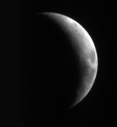 This crescent view of Earth Moon in infrared, blue-green, and red wavelengths comes from a camera test by NASA Mars Reconnaissance Orbiter spacecraft on its way to Mars.