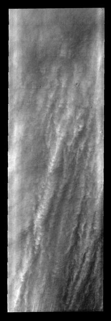 These linear clouds are just one of many storm fronts that occurred near the south pole during the late southern summer season