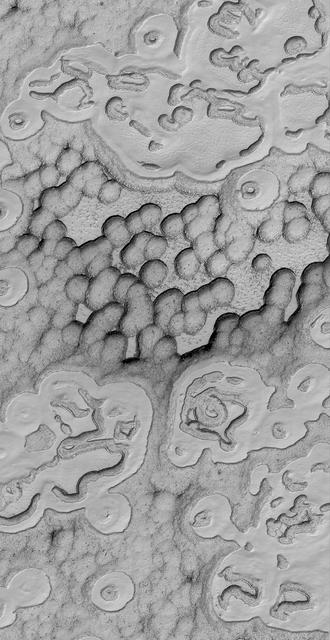 This Mars Global Surveyor MGS Mars Orbiter Camera MOC image shows a spectacular summertime view of a portion of the south polar residual cap