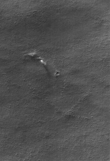 This Mars Global Surveyor MGS Mars Orbiter Camera MOC image shows dust plumes created by gusting winds on a plain southwest of Argyre Planitia