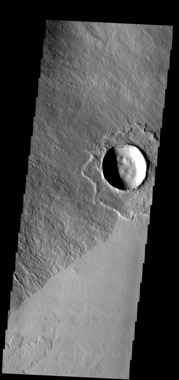 This crater is located on the flank of Ascraeus Mons