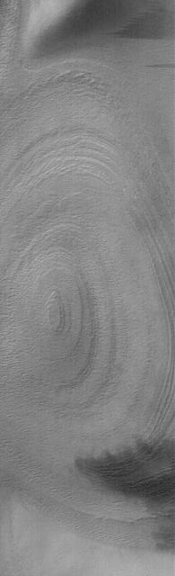 This Mars Global Surveyor MGS Mars Orbiter Camera MOC image shows an eroded stack of layered material in a crater of the south polar region of Mars