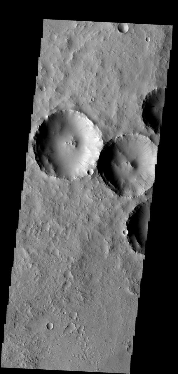Dust slides occur within the larger craters in this image