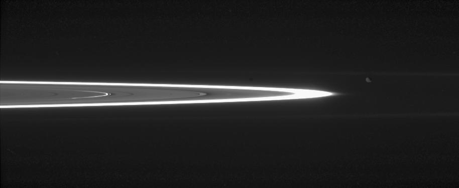 Tiny, dust-sized particles in Saturn rings become much easier to see at high phase angle -- the angle formed by the Sun, the rings and the spacecraft. The brightest ring is the F ring; the next feature to the left is the outer edge of the A ring