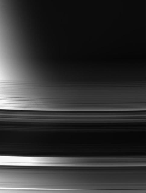 With Saturn terminator as a backdrop, this view of the unlit face of the rings makes it easy to distinguish between areas that are actual gaps, where light passes through essentially unimpeded, and areas where the rings block or scatter light