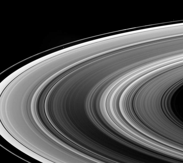 This view looks down onto the unlit side of Saturn ringplane. It nicely shows a near-arm/far-arm brightness asymmetry in the B ring: The near arm of the B ring is notably darker from this viewing geometry than is the far arm
