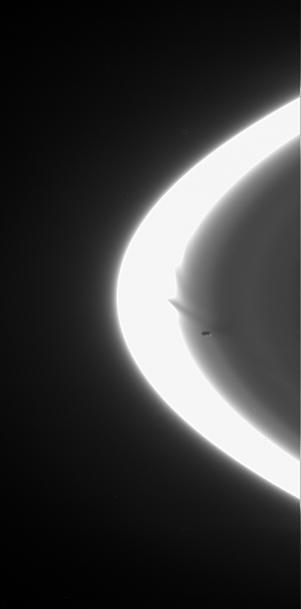 Prometheus zooms across the Cassini spacecraft field of view, attended by faint streamers and deep gores in the F ring. This movie sequence of five images shows the F ring shepherd moon shaping the ring inner edge