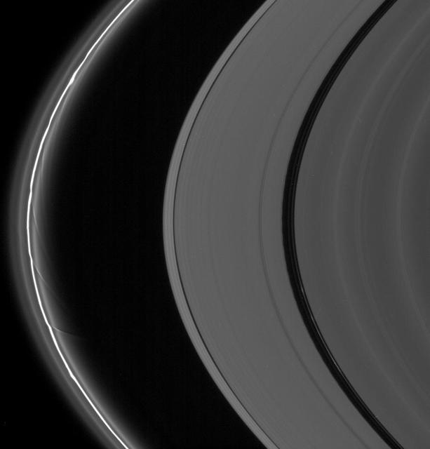 The A and F rings are alive with moving structures in this Cassini spacecraft view. Graceful drapes of ring material created by Prometheus are seen sliding by at left, while clumpy ringlets slip through the Encke Gap