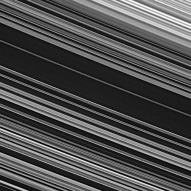 The spoke-producing region of the B ring displays fine-scale asymmetry in the azimuthal direction -- the direction along which the ring particles orbit Saturn -- from upper left to lower right across the image