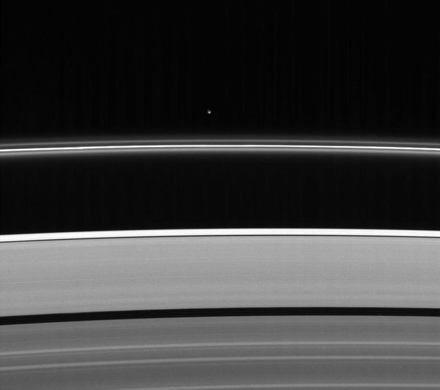 Less intrusive than her sibling shepherd moon, Pandora nonetheless provides a gravitational influence that helps confine and perturb the F ring shape